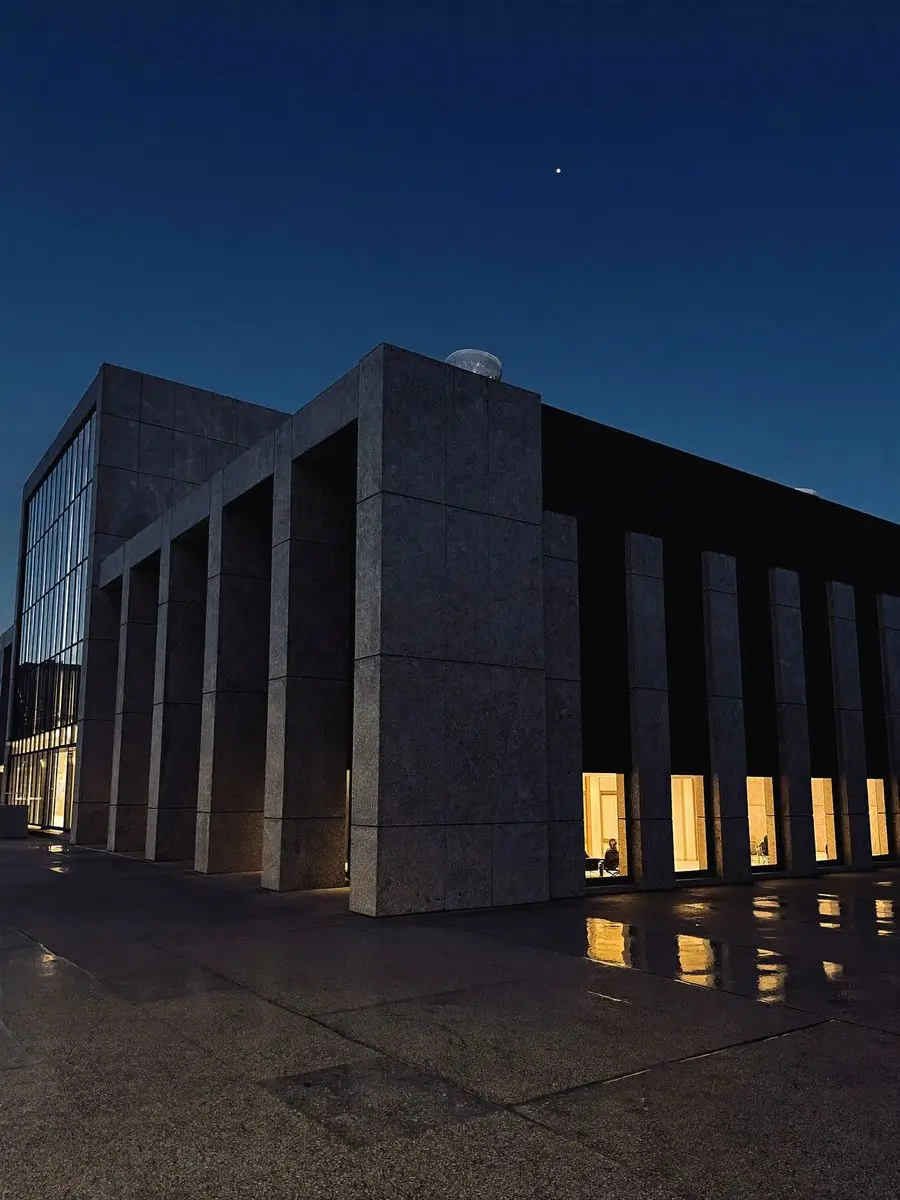 Institutional colonnade at blue hour